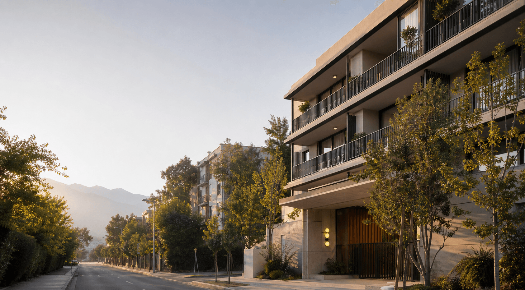 Edificio residencial contemporáneo en una calle arbolada de Santiago